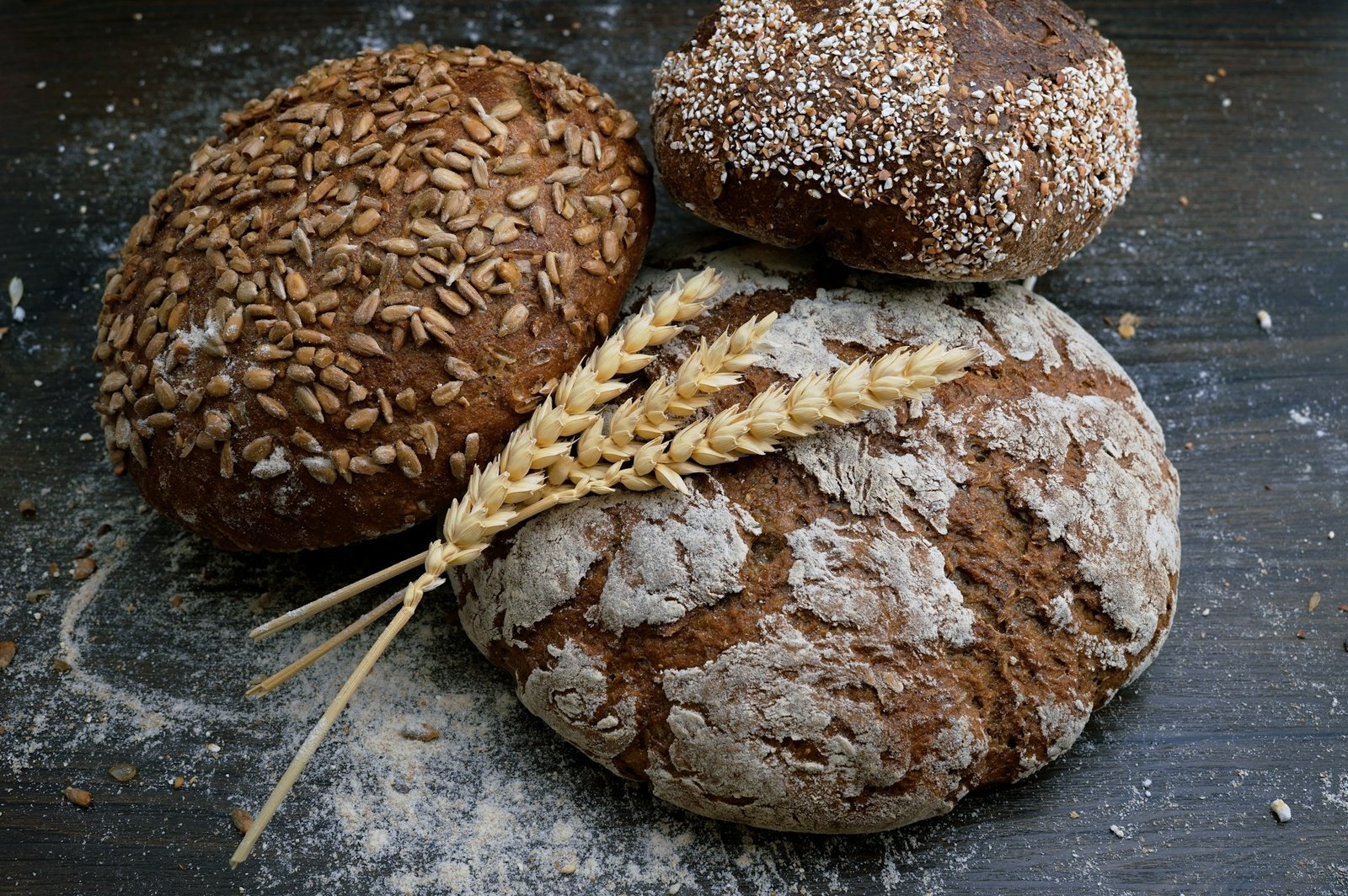 Freshly baked artisan bread loaves on a wooden board