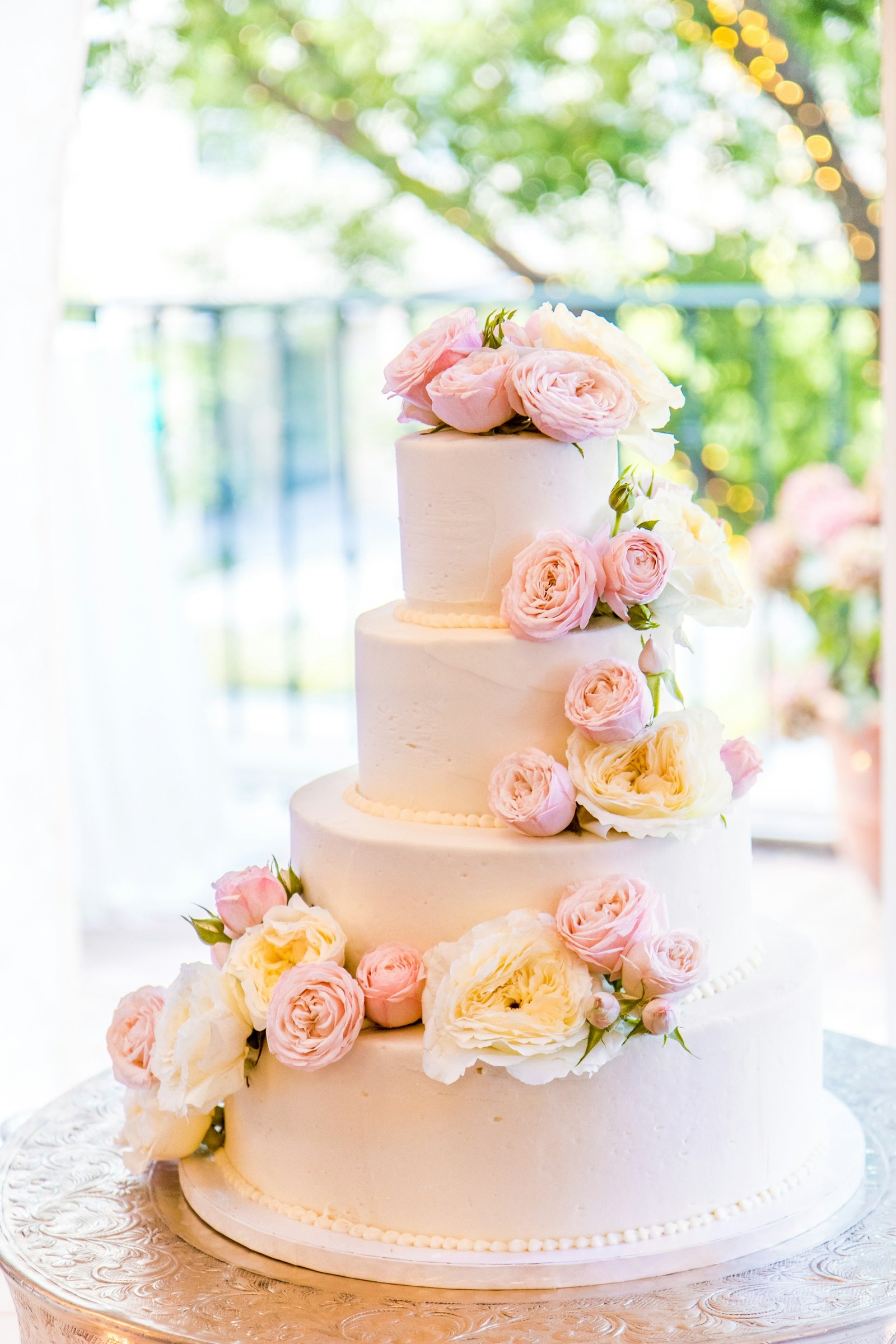 Elegant white wedding cake with delicate floral details